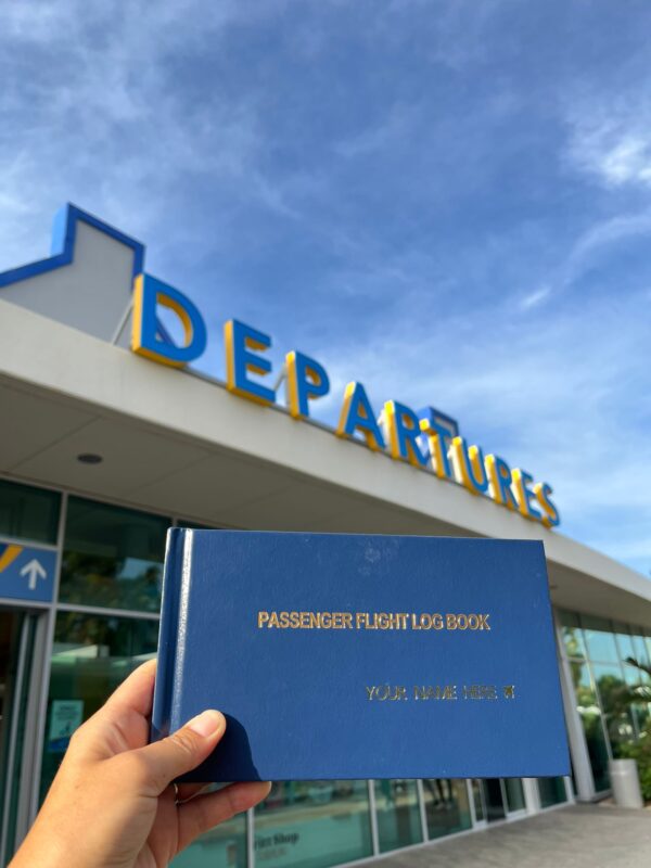 Curaçao Departure Sign with Passenger Flight Logbook.